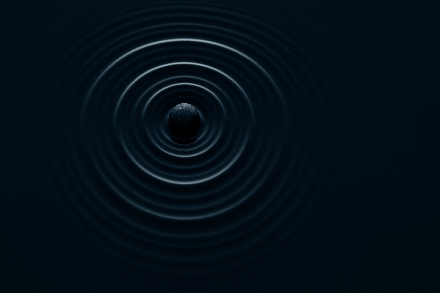 Concentric ripple rings in dark still water, photographed from above